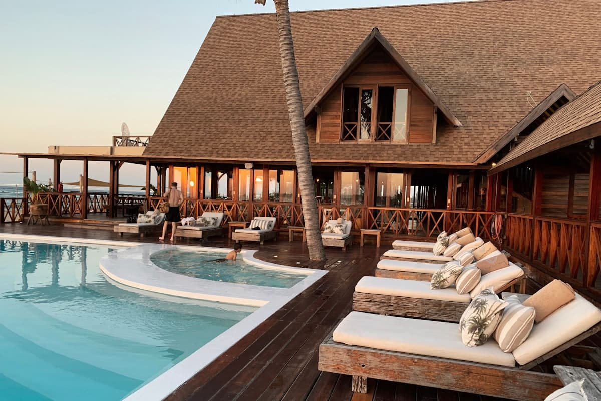 Poolside at a beachfront resort at golden hour