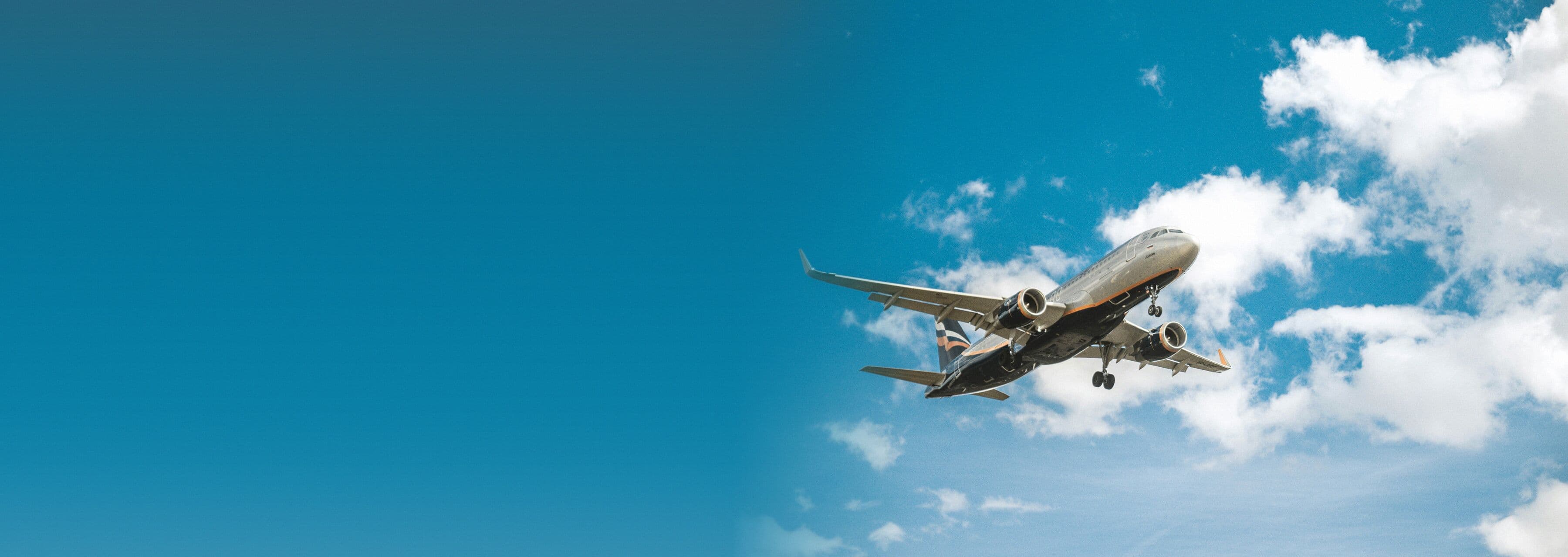 An airliner climbing away from the runway