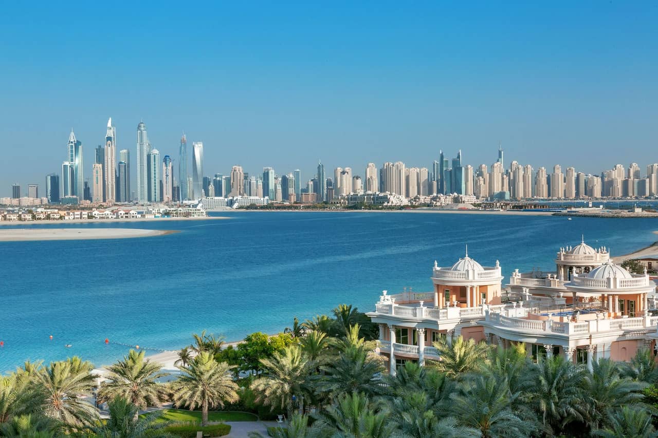 The towers of Dubai Marina across the water from Palm Jumeirah on a clear day